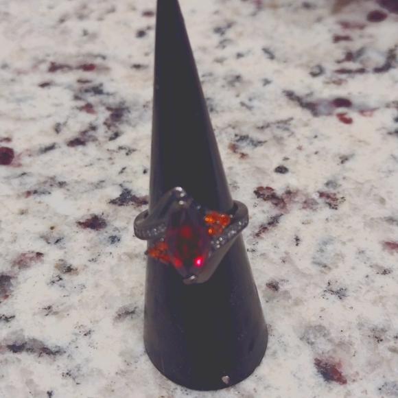 Garnet and pink stones with diamond accents